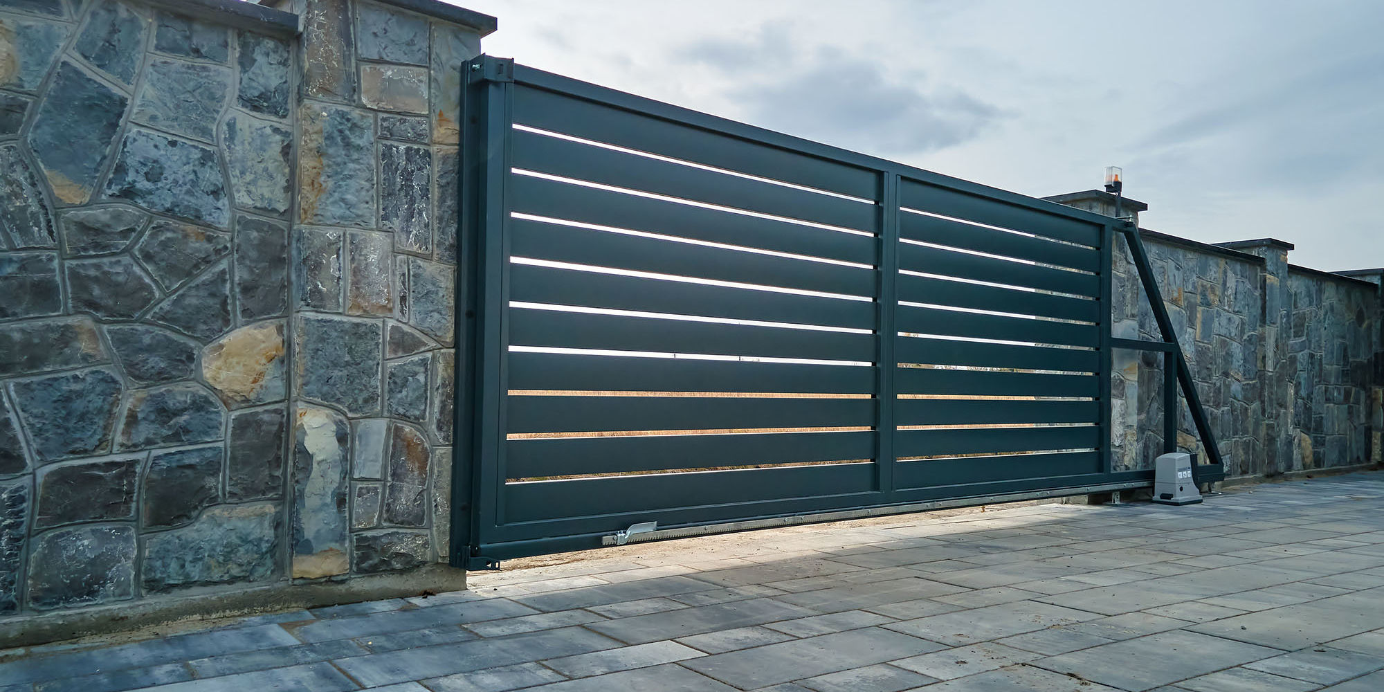 Security gate in brick wall